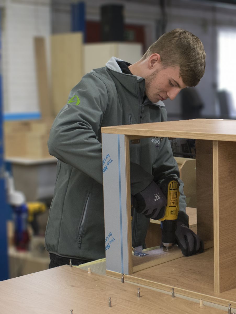 Aspen Concepts apprentice fixing a screw