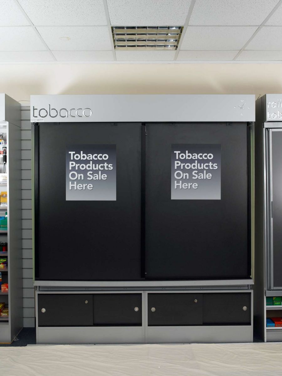 tobacco and cigarette cabinet with self closing doors
