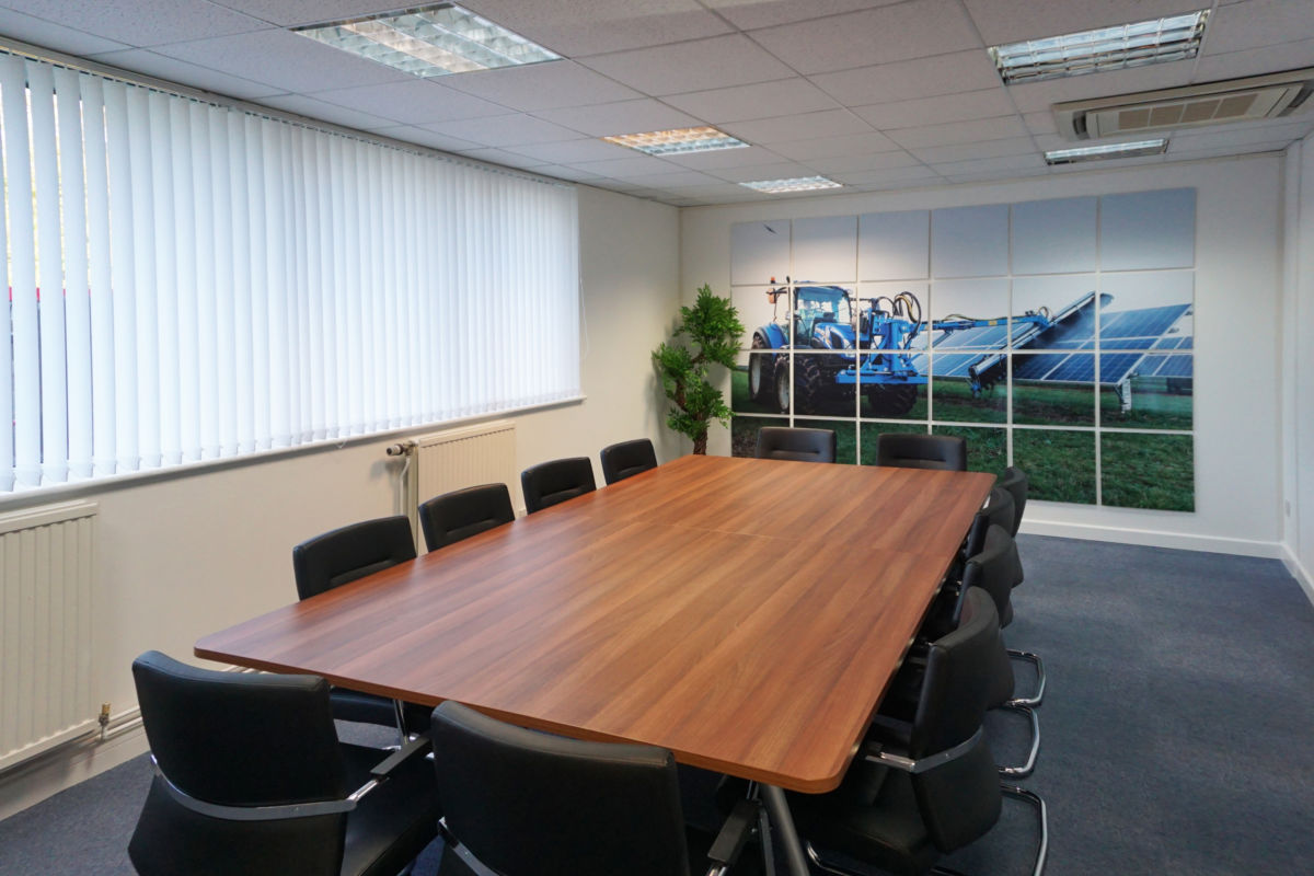 Boardroom table and graphic display installed by Aspen Concepts