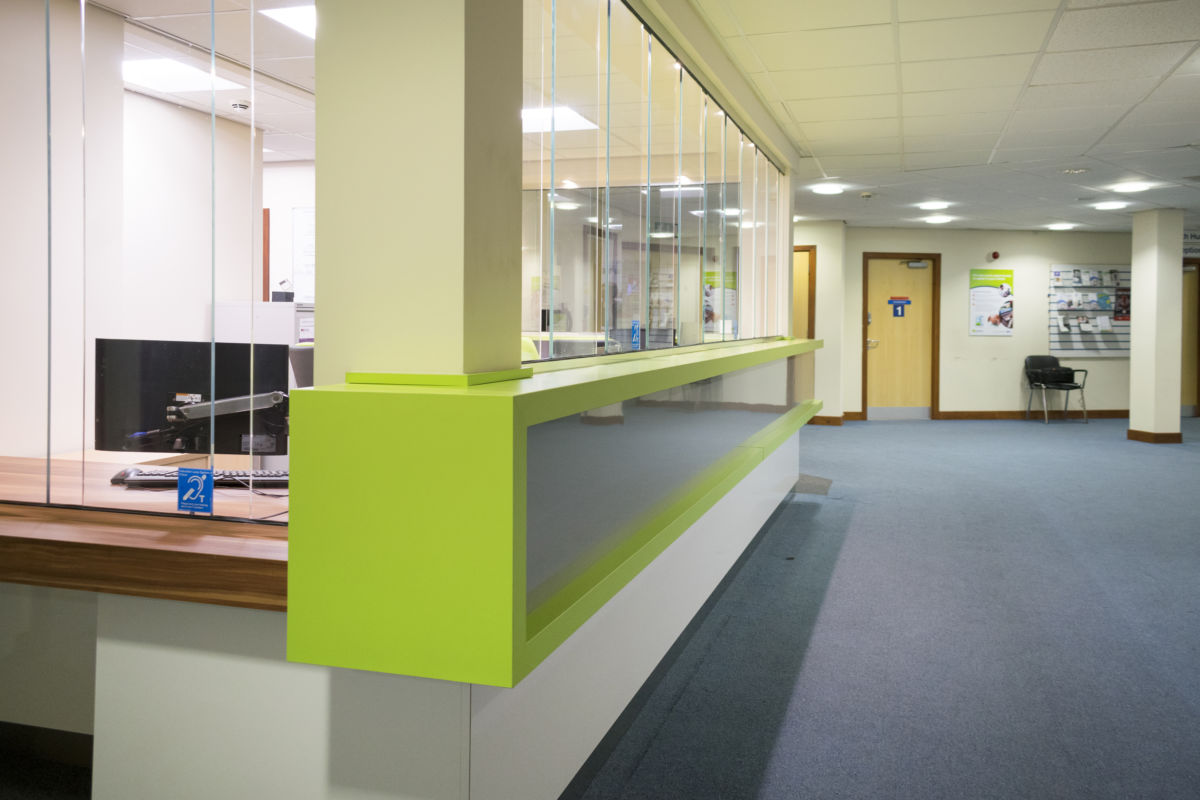 Healthcare - Enki medical prctice waiting room reception desk with protective glazing
