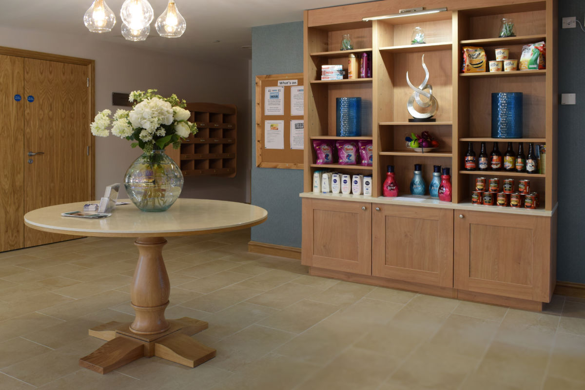 bespoke joinery table and shelves - retirement home reception
