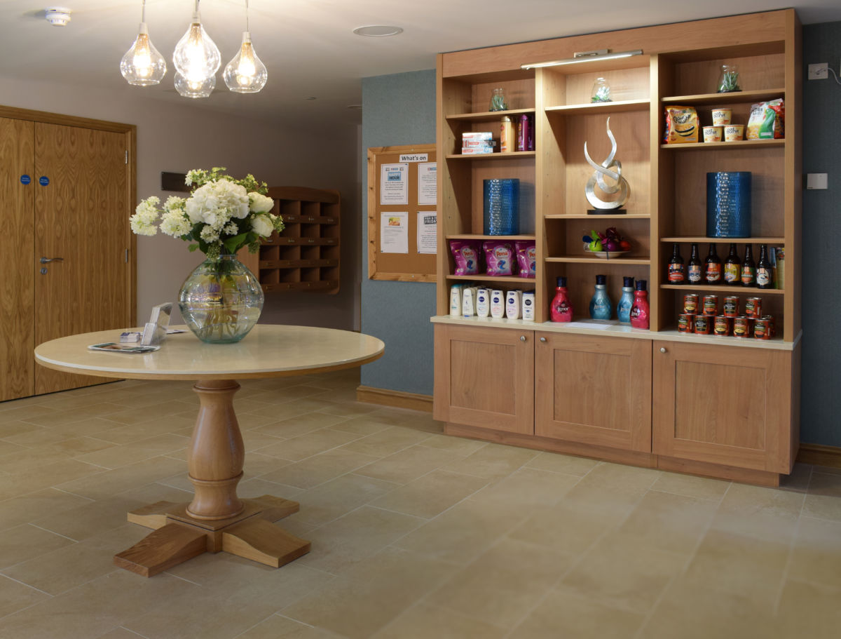 bespoke joinery table and shelves - retirement home reception